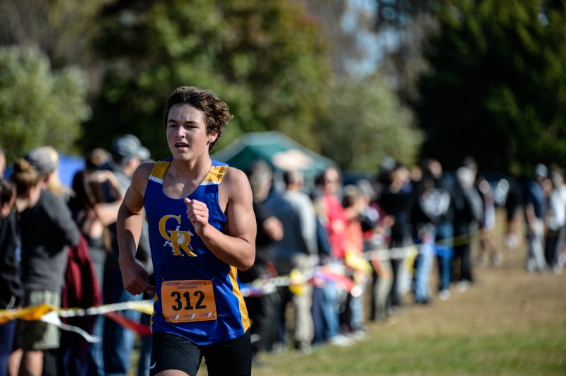 Quade Cummings of Caesar Rodney pushes to a time of 18:56.