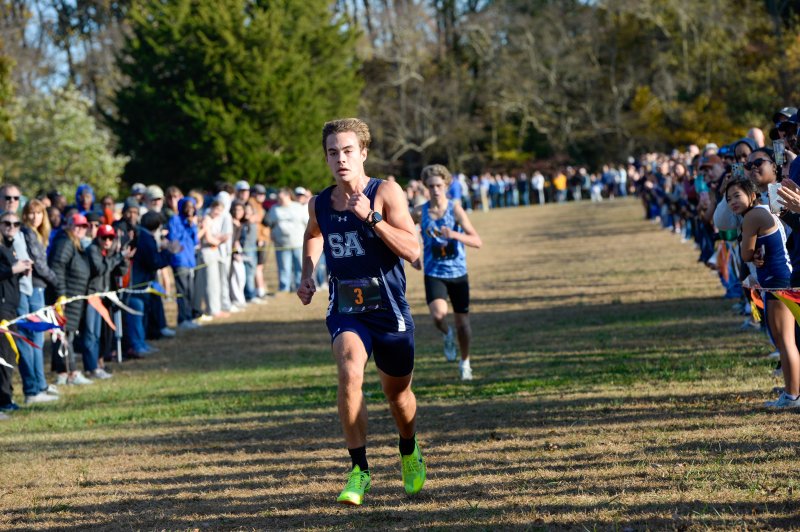Ryan Moody of Sussex Academy outkicks Jason Baker of Cape to win the race in 16:02.