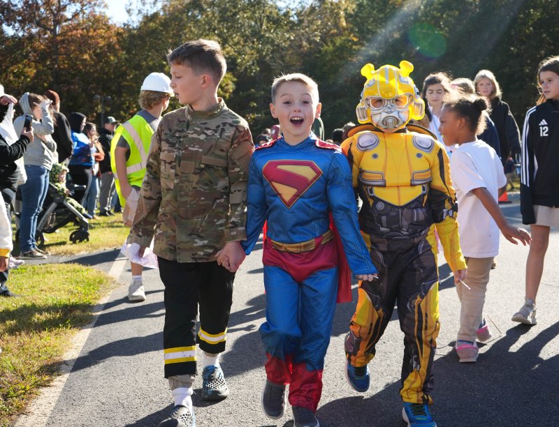 Sussex Academy’s Halloween Community Hero Day Oct. 31, ends with a student costume parade outside the elementary school. Dressed as Superman is Emmitt Kosiorowski. To his left is Jayson Baeschlin. ELLEN MCINTYRE PHOTOS