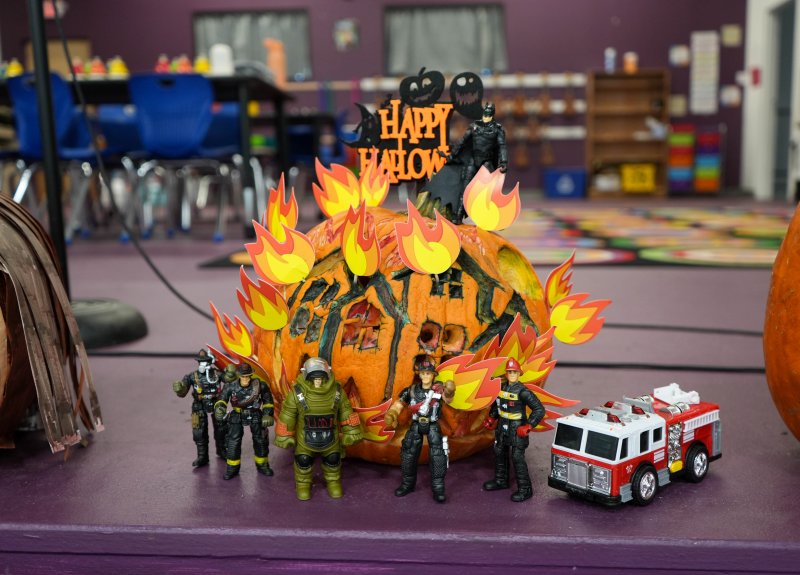 Sussex Academy Dean of Elementary Connie Hendricks decorated this winning pumpkin, “Pumpkin on Fire,” which features a house on fire and figurines of first responders and a fire truck at the scene.