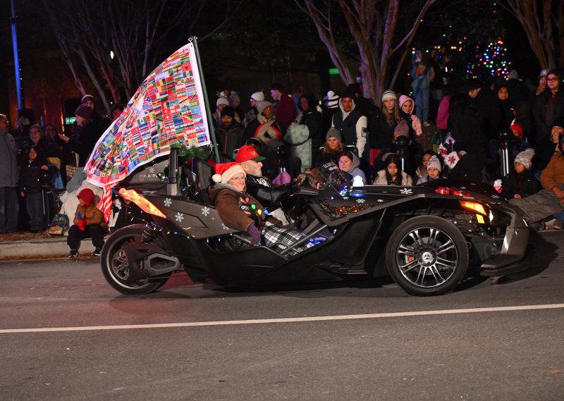 A fancy tricycle has two front wheels on this Steel Horse Knights trike.