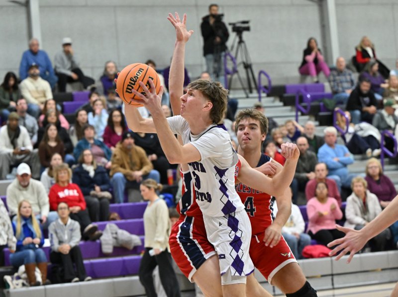 Junior Noah Barbrow goes to the hoop in the paint.