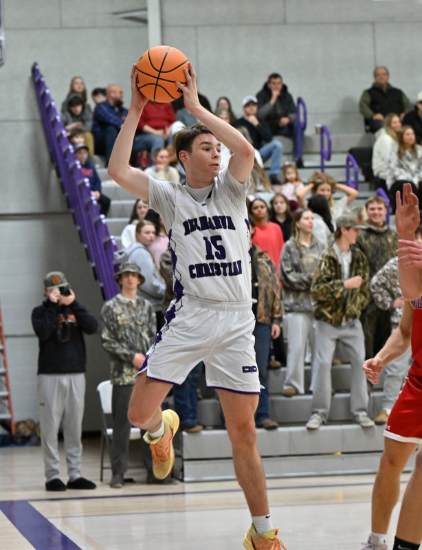 Royals senior Gideon Woods saves a ball on the baseline.
