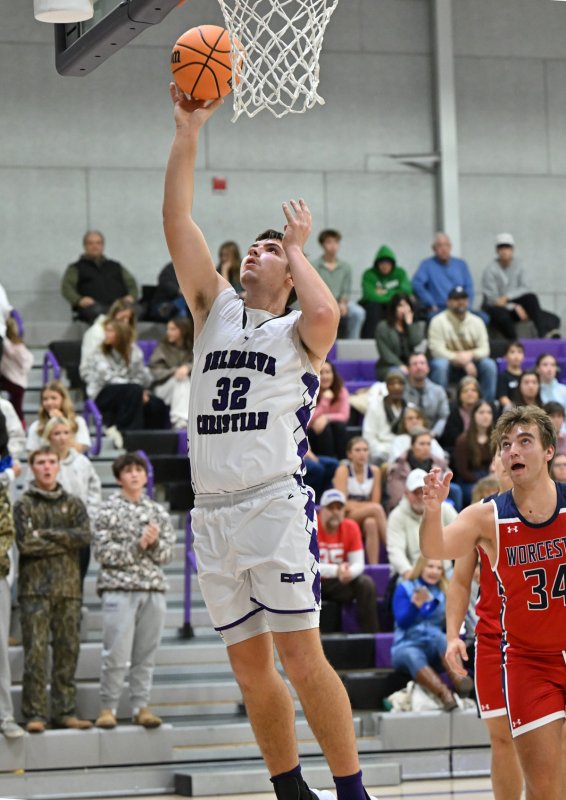 Senior Andrew Collins goes strong to the hole for the Royals.