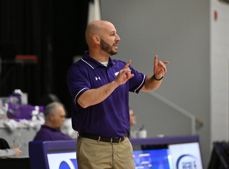 Royals boys’ coach Part Woods calls out an offensive play.