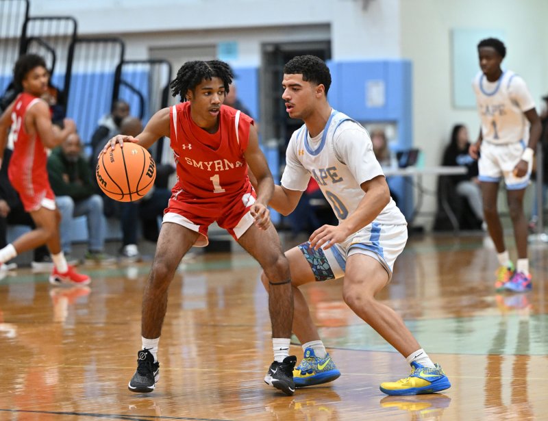 Cape senior Lamar McCoy plays close defense on Smyrna’s John Couch.