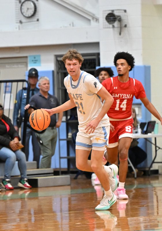 Cape senior Lawson Whaley starts a fast break up the sideline.