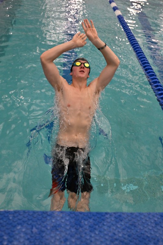 Sophomore Patrick Healy leaves the blocks in the backstroke at a recent practice.