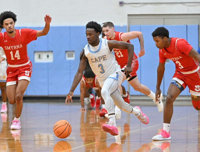 Cape senior David Barnes speeds the ball up the court on a fast break.