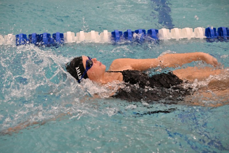 Cape senior Alysa McCarthy swims the backstroke.