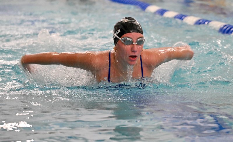 Senior Leah Sullivan swims the butterfly.