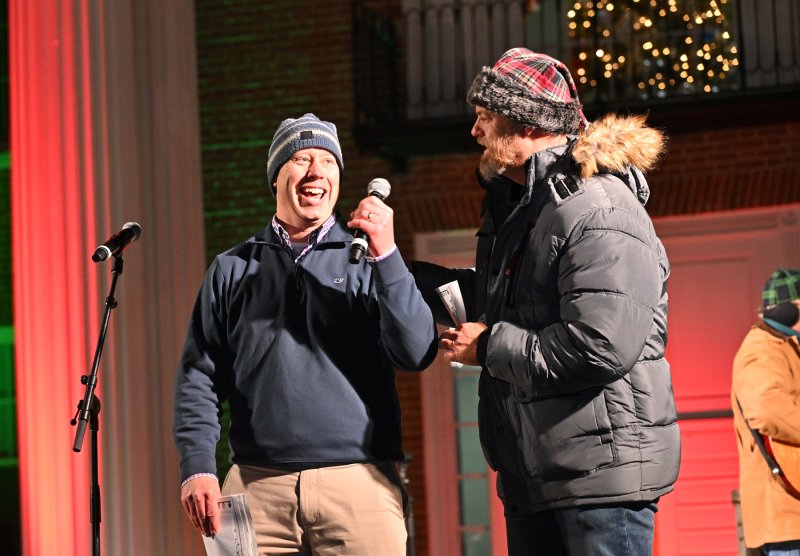 Sussex County Administrator Todd Lawson, left, has a lighthearted moment with emcee Jason Lee.