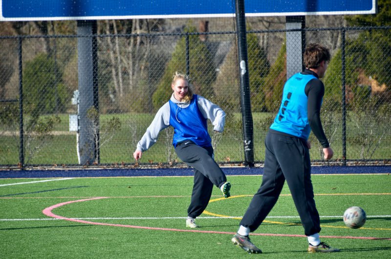Class of 2024 graduate Carmen Merrick passes the rock.