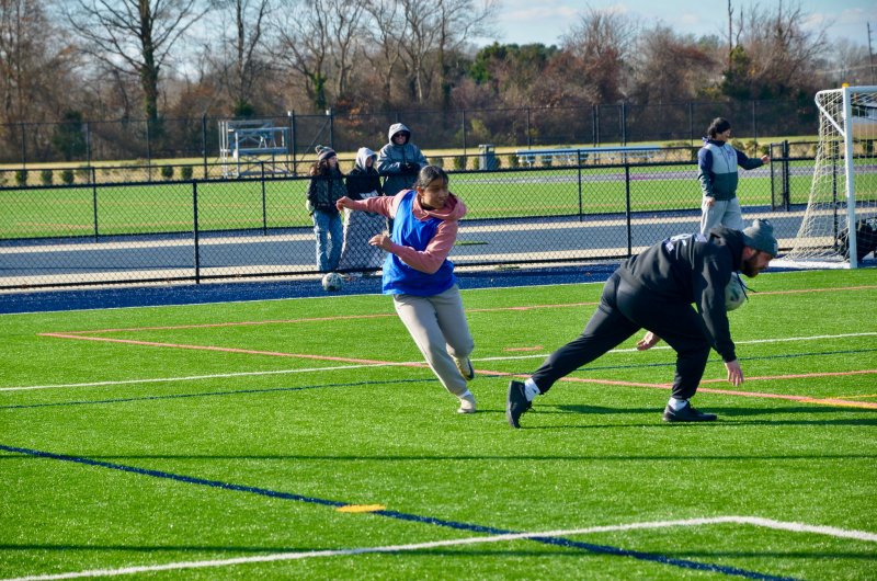 Class of 2025 graduate Ashley Alvarez has her clear blocked by R.J. Dina.