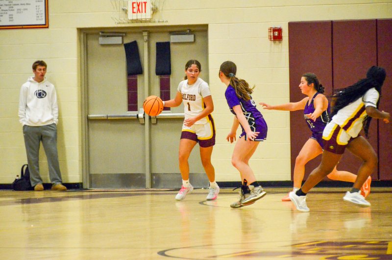 Delmarva Christian sophomore Avery McCoy pops out to defend Tristen Showell.