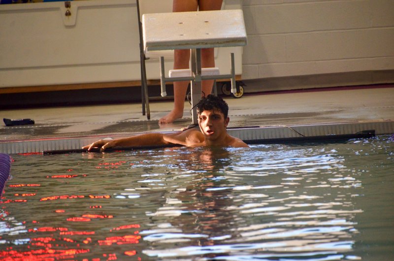Sussex Academy senior Christian Wright looks for his mom, who was taking pictures, after he broke his program record in the 200 freestyle with a time of 1:52.18.
