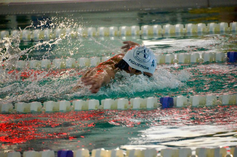 Seahawks senior Angel Figueroa sports the new swim cap, with the ALS ribbon toward the front.