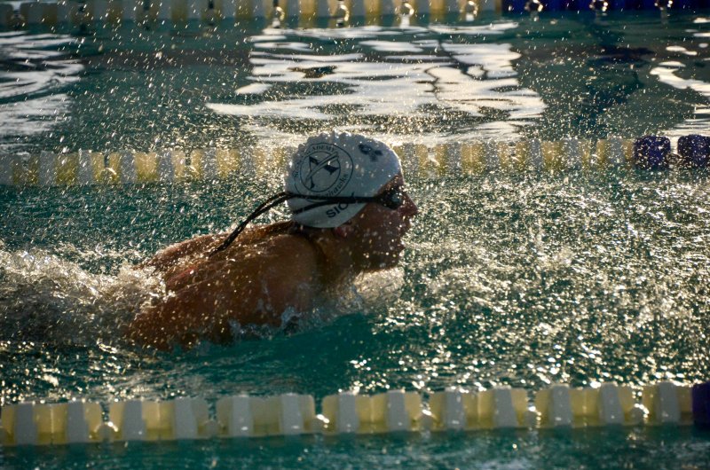Seahawks freshman Kaleb Siok bursts from the water.