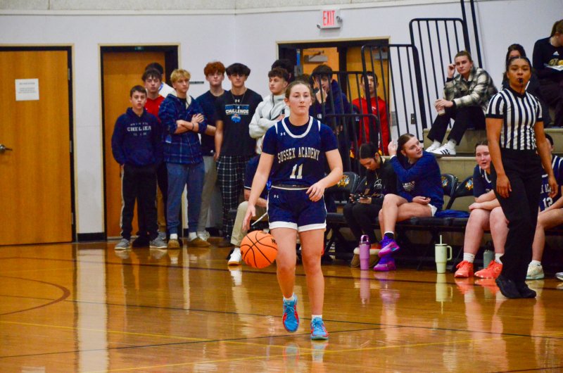 Sussex Academy sophomore Reilly Mobilia brings the ball up the court.