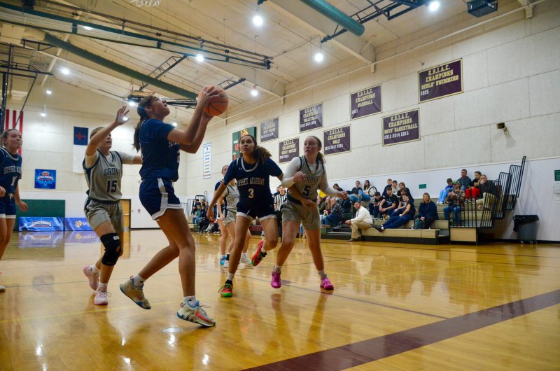 Sussex Academy eighth-grader Savannah Hope looks up for a shot.