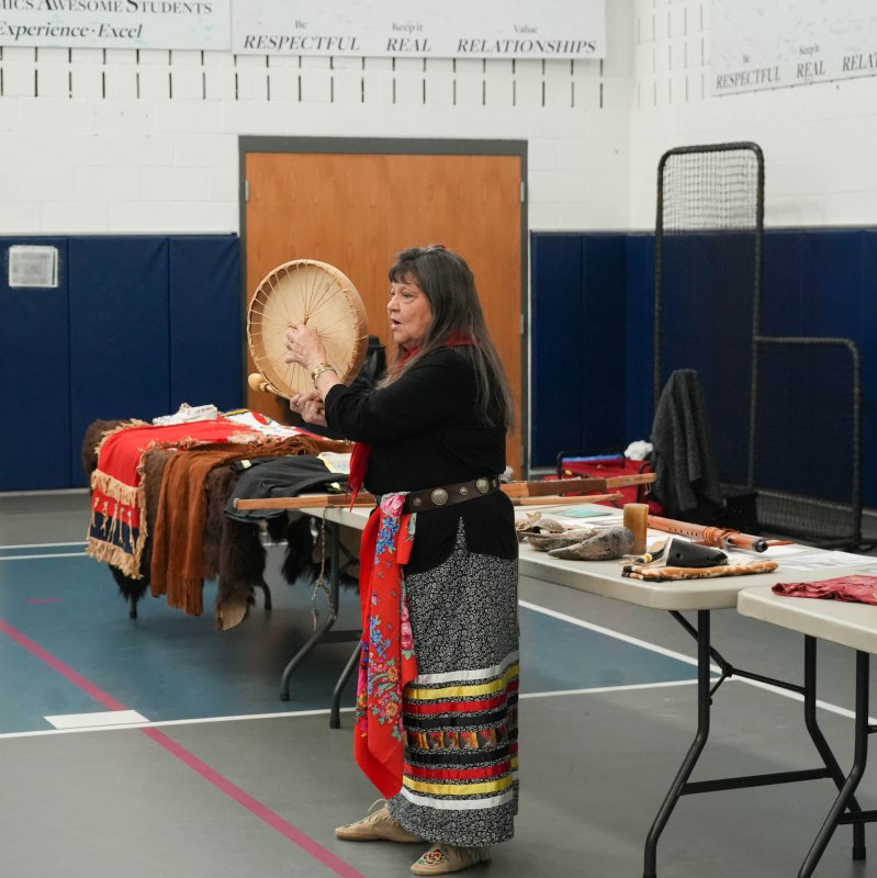 Boe Harris-Nakakakena shows off a drum during her presentation at Sussex Academy Nov. 13.
