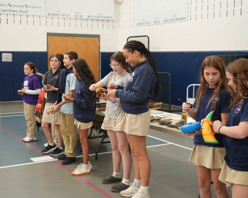 Sussex Academy sixth-graders experiment with some traditional musical instruments. Shown are (l-r) Zoe Sexton, Alexsis Frantz-Andrie, Lucca Palmeri, Kay Samayoa-Gijalva, Mary Bowe, Aialiyah Brunskill, Kali Campanese and Carmela Hudson.