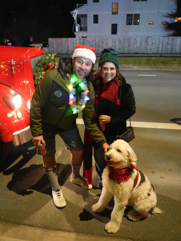 Chad Ackland, left, and Ximena Leon enjoy the evening with their dog, Max.