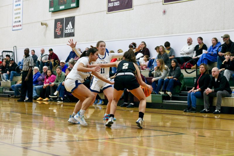 Seahawks freshman Patti Lara Nieto, left, and sophomore Reilly Mobilia work a trap.