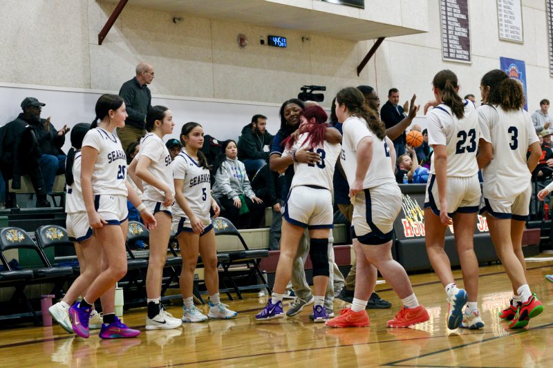 Sussex Academy coach Rayona Benson consoles Bella Zorn after the Seahawks fell just short of a remarkable comeback-win.