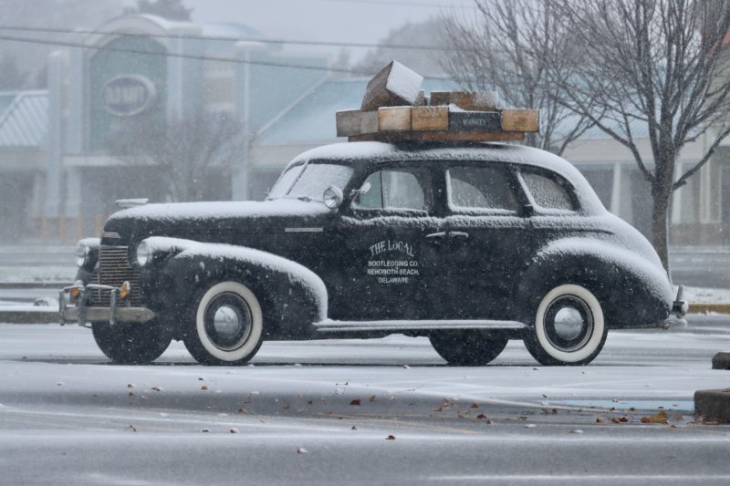 Snow on a vintage car outside The Local in Rehoboth Beach makes for a classic winter scene. BILL SHULL PHOTO