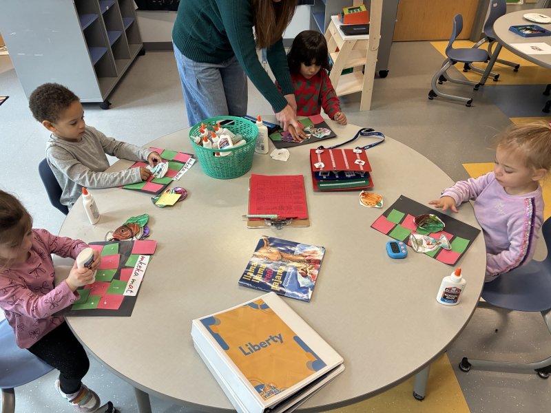 Little Vikings students working on their mkeka mats for Kwanzaa are (l-r) Francesca Blau, Nicolas Hazzard, Mason Kaushal and Liberty Kelley. SUBMITTED PHOTOS