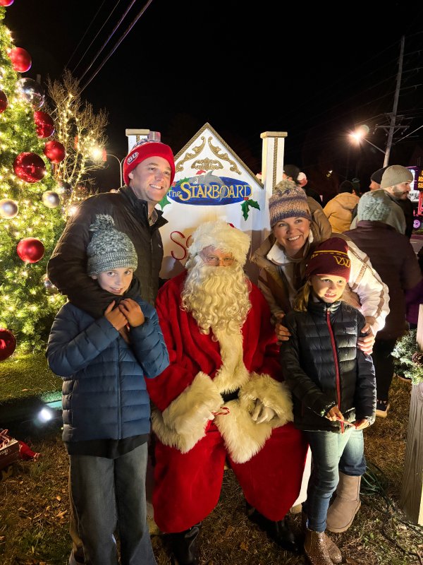 The Finlay family meets Santa Claus at the Fifer’s Farm Kitchen tree-lighting. In back are J.P., left, and wife Lauren. In front are daughters Shelby, left, and Ainslie.