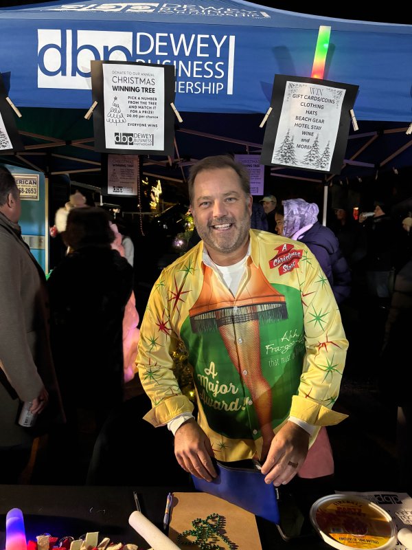 Rich Godbout of the Dewey Business Partnership helps out at the tree-lighting.