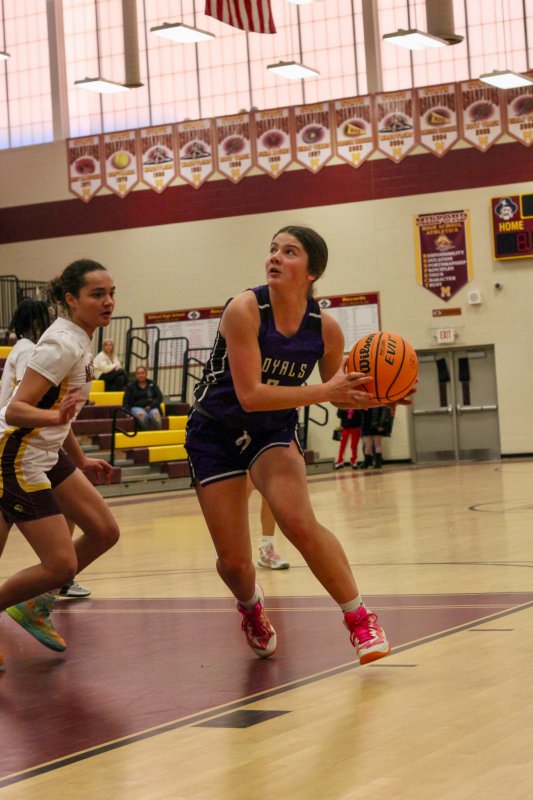 Delmarva Christian senior Eve Bohinski looks up at the cup.