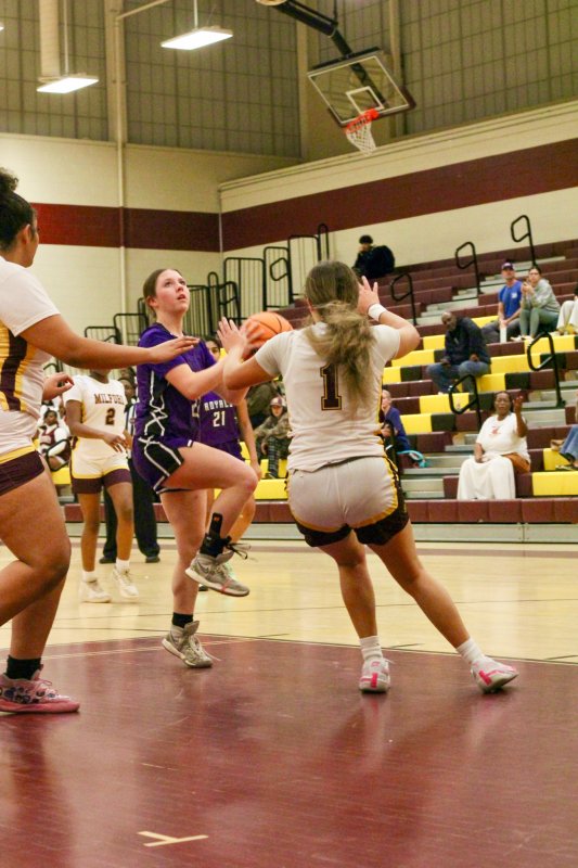 Royals sophomore Avery McCoy heads up for a lay-up.