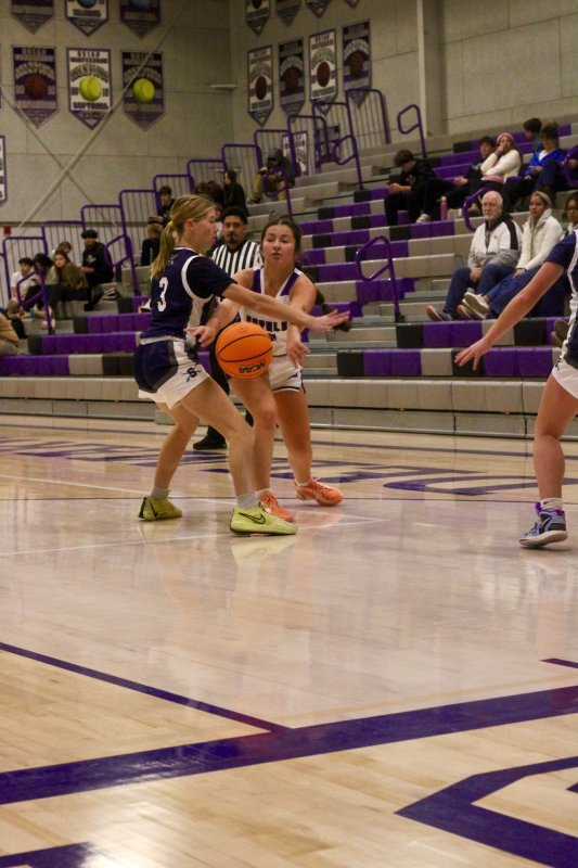 Royals sophomore MarkyKate Dougherty passes inside.