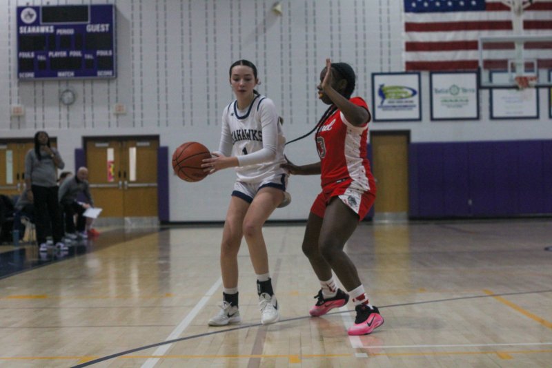 Sussex Academy sophomore Jaelyn Mattingly is guarded by sophomore Tyra Kane, who finished with 10 steals and 10 points in the Bulldogs’ 37-16 win over Sussex Academy Dec. 9. AARON R. MUSHRUSH PHOTOS