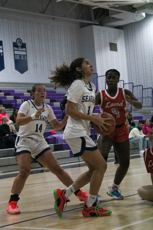 Sussex Academy freshman Barb Carneiro-Duarte heads up inside.