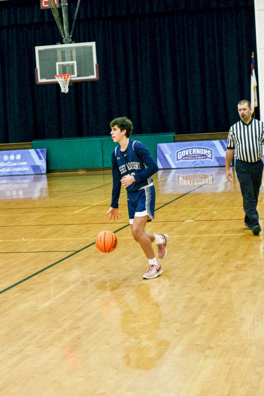 Sussex Academy junior Ryan Dostal brings the ball up.