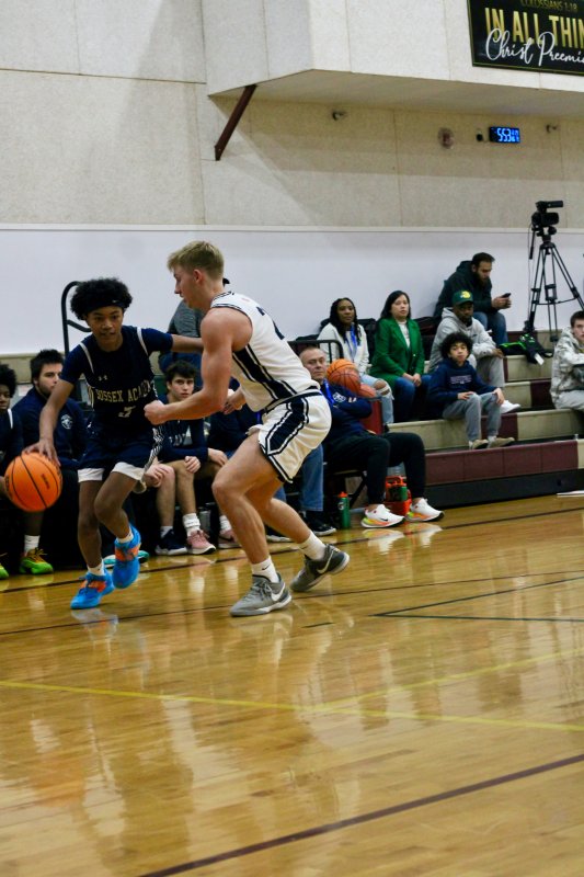 Sussex Academy sophomore Rico Nock gets past his defender.