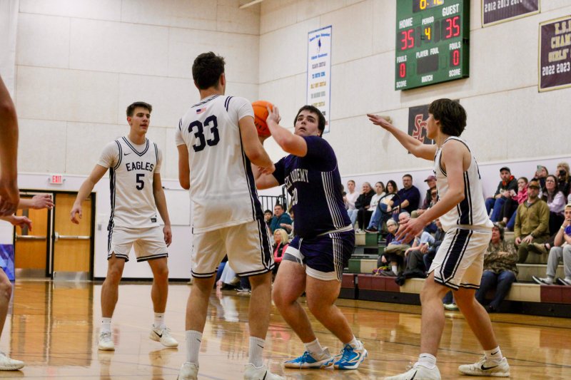 Sussex Academy sophomore Ty Jarrell has to throw up a shot with the shot clock winding down.