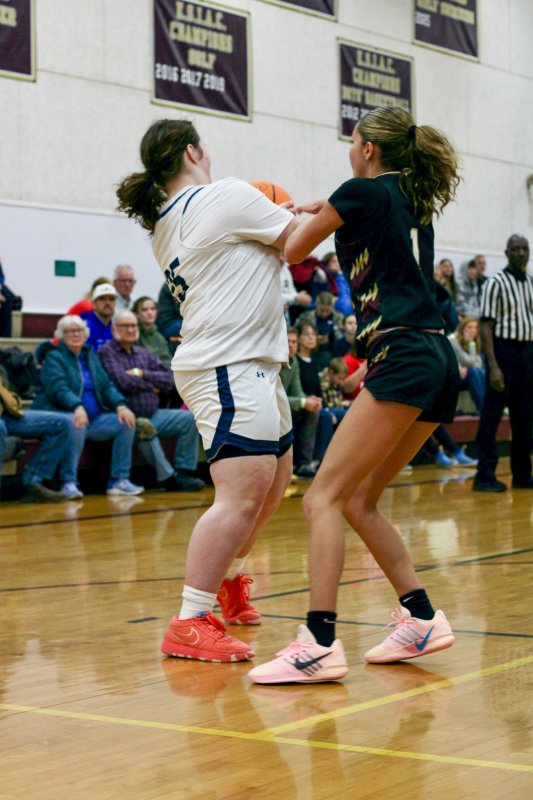 Sussex Academy senior Eva Boos fights for the ball.