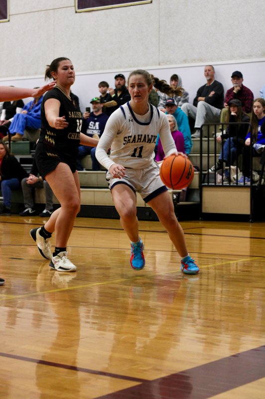 Sussex Academy sophomore Reilly Mobilia drives past her defender.