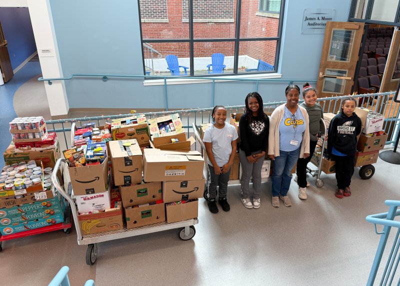 Gathered with some of the donated items collected in Lewes Elementary’s recent food drive are (l-r) Alonna Hudson; Amiyah Tunnell; Harper Collick; Lovell Hemphill, school social worker; and Drayden Vann. SUBMITTED PHOTOS