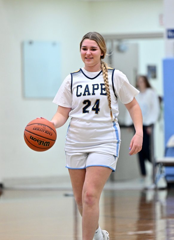 Unified partner Brynne Fox brings the ball up the court.