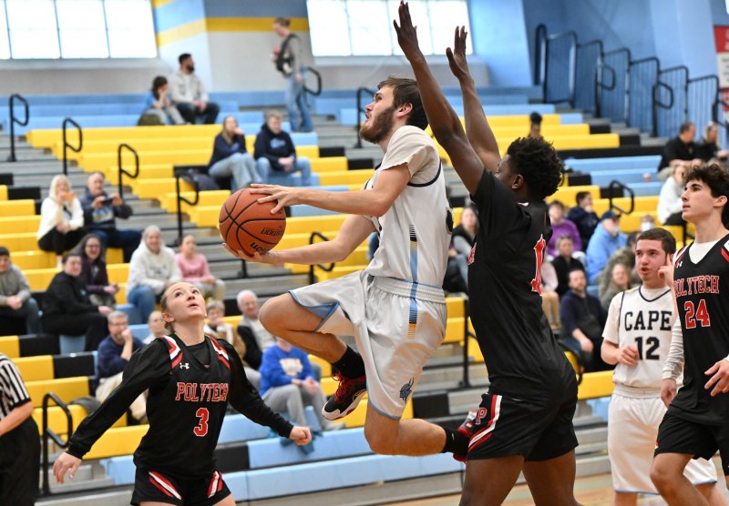 Cape junior Jaxon Benton glides in for a basket in the 54-48 victory over Polytech. He scored 10 points in the win. DAN COOK PHOTOS