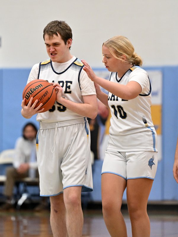 Senior Daniel Gartman gets an assist from unified partner Elizabeth Sprague.