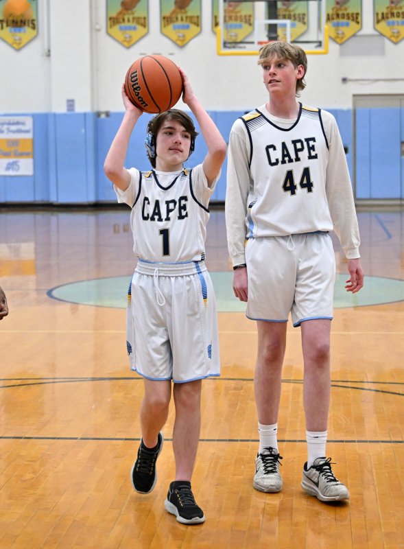 Cape sophomore Harlan Jones looks to shoot with an assist from unified partner Erichson McMahon.
