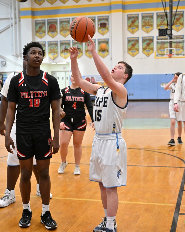 Cape sophomore Luke Archer shoots a basket in the paint past Polytech’s Amire Robinson.