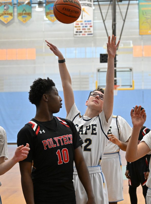 Freshman Cullen Oliver scores a basket for the Vikings.